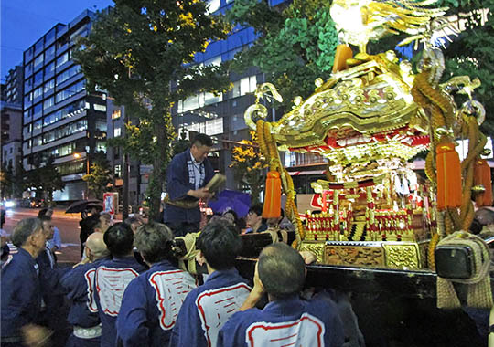 The procession moves through the neighborhood