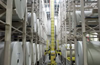 Transporting roll-type objects: collaboration with automated warehouses/retrieval system